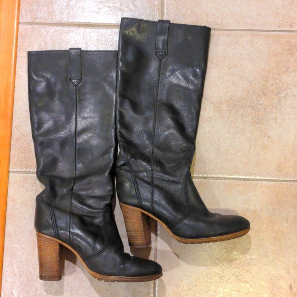 Tall black leather heeled boots